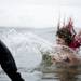 EMU student Katie Compton from the Dirty Dan and the Ice Cold Clan team jumps into Ford Lake on Saturday, Feb. 16. Daniel Brenner I AnnArbor.com